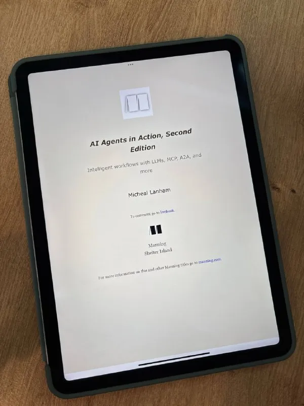 Обложка книги AI Agents in Action, Second Edition Майкла Лэнхэма на экране планшета